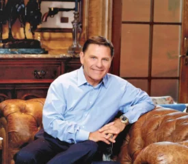 Kenneth Copeland in his office on the couch