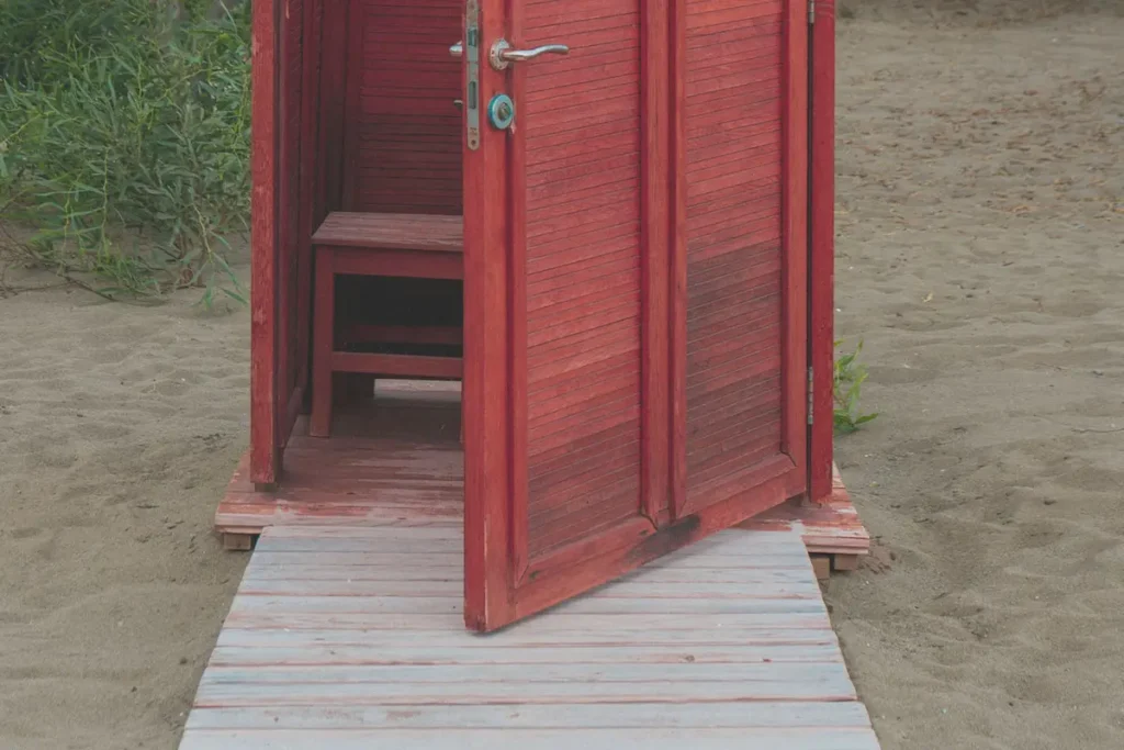 An open door to a small hut on the beach
