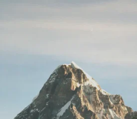 A mountain peak against a bright blue sky