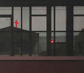View from a window of a neon red cross atop a building in the distance