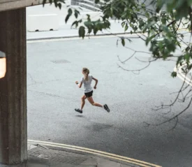 Window-view of girl running on the street