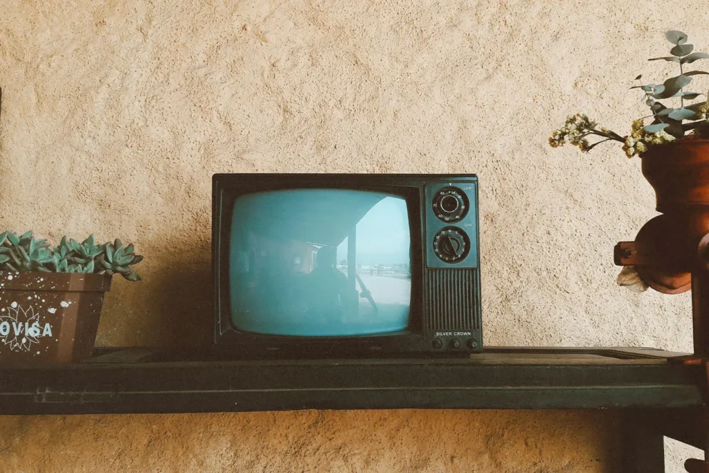 Turn dial box TV on a wooden shelf