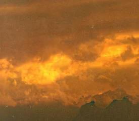 Dramatic sky filled with glowing orange clouds during a vivid sunset
