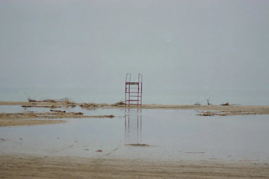 Metal scaffolding in the middle of sandy shore
