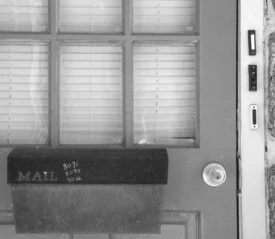 Mail box on the front door with doorbell