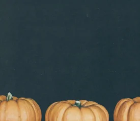 three pumpkins with black background