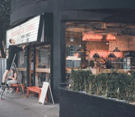 Street-view of cafe store window and theatre sign