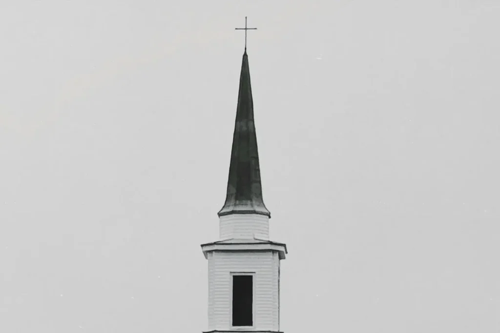 Church steeple with a cross on the top