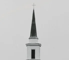 Church steeple with a cross on the top