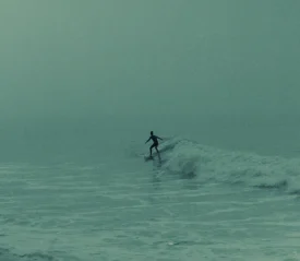 Person surfing a wave