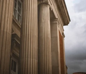 A front of a courthouse against a gray sky, representing standing for your covenant rights