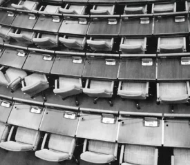 black and white photo of the empty senate seats
