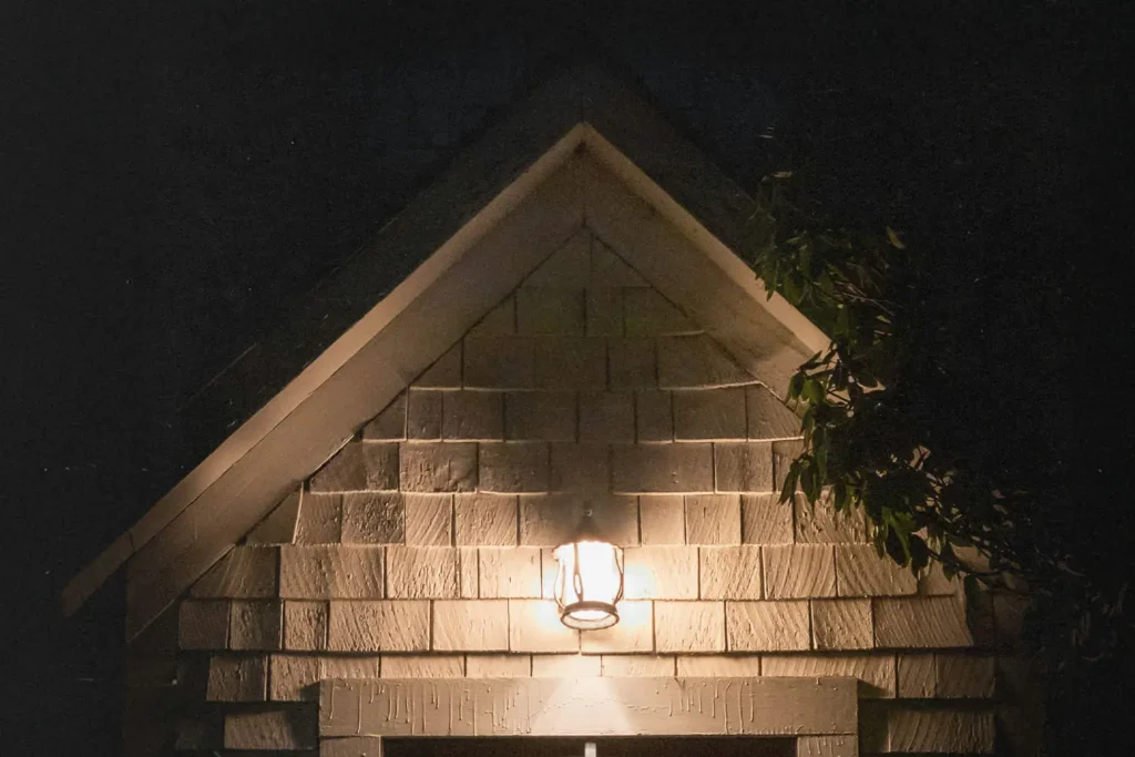 house with light on above the door