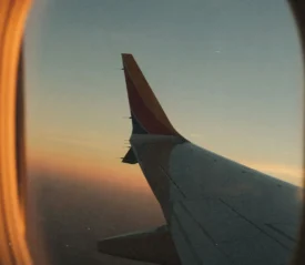 airplane wing through the window of the airplane