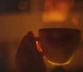 Hand holding coffee mug