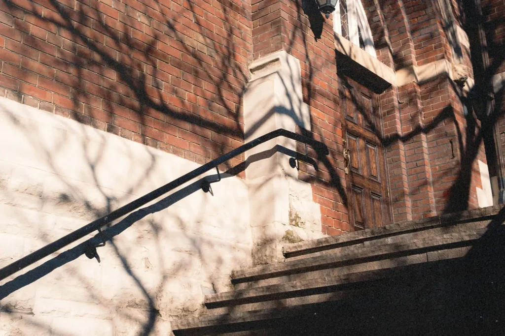 steps up to the front door of a brick church