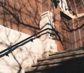 steps up to the front door of a brick church