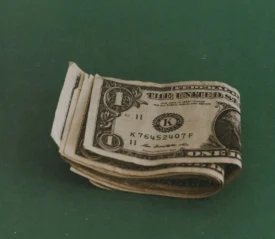 single dollar bills folded together