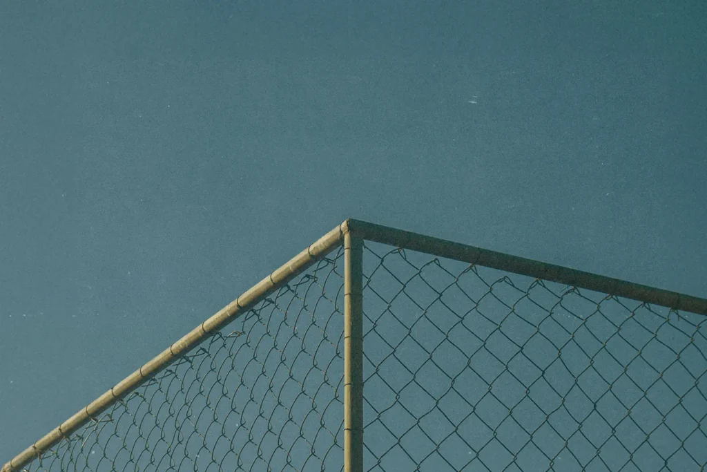 top corner of a chain link fence
