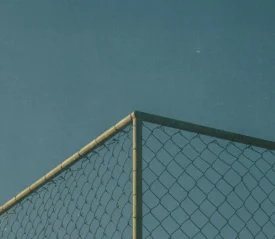 top corner of a chain link fence