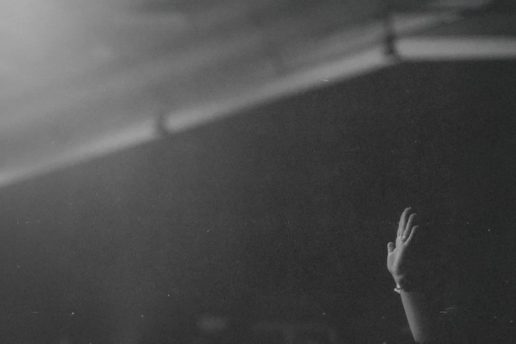 Single hand lifted in praise