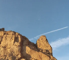 Rocky mountain top with clear blue sky in the background