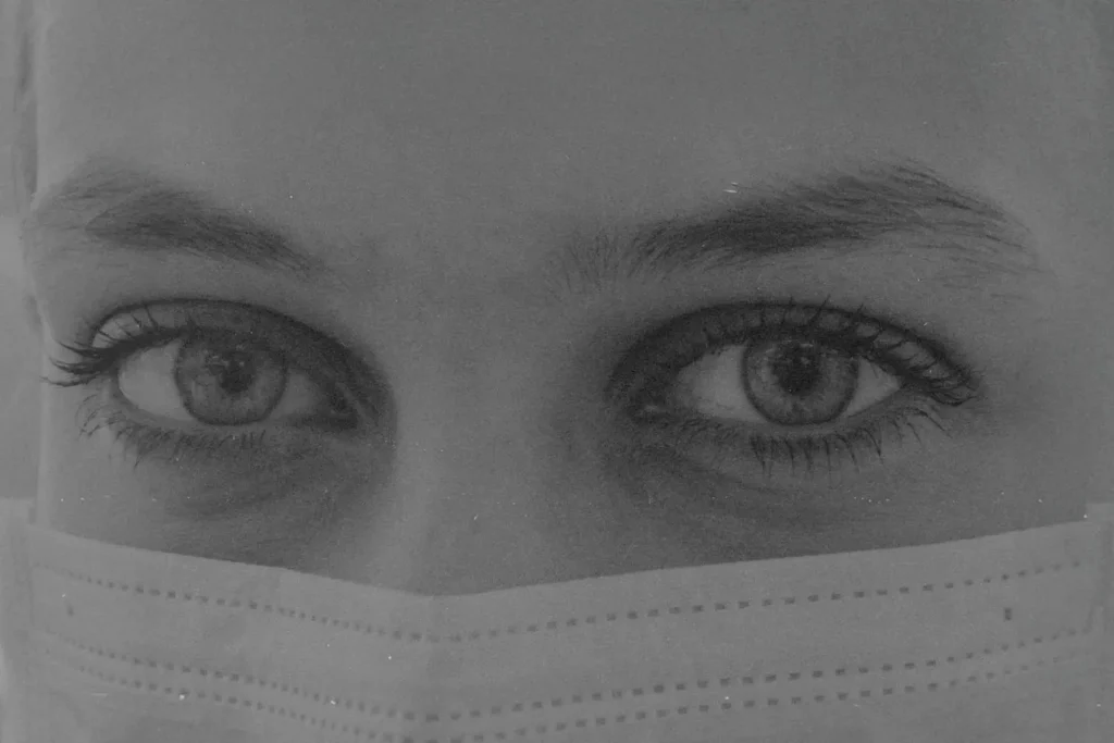 Close-up of person's face covered with a mask