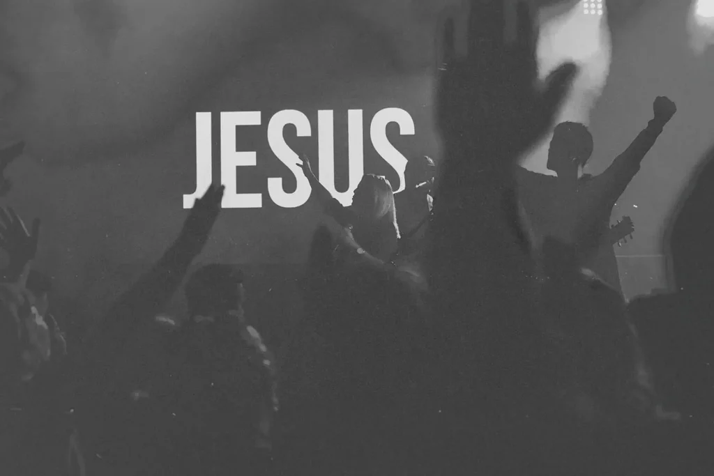 LED screen that reads "JESUS" with hands lifted