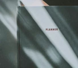 Cover of a monthly planner in low. moody light