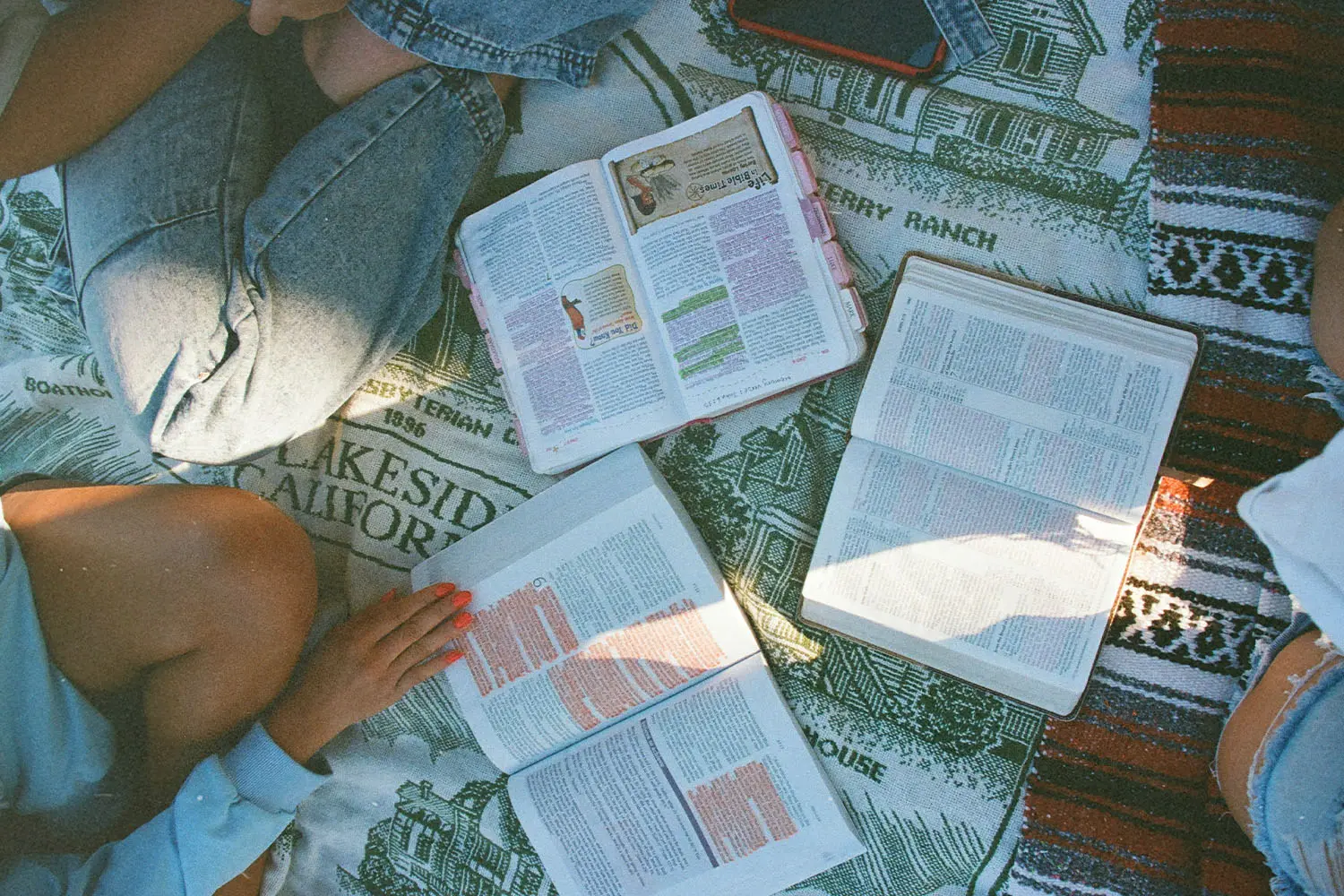 Group of people with 3 open bibles