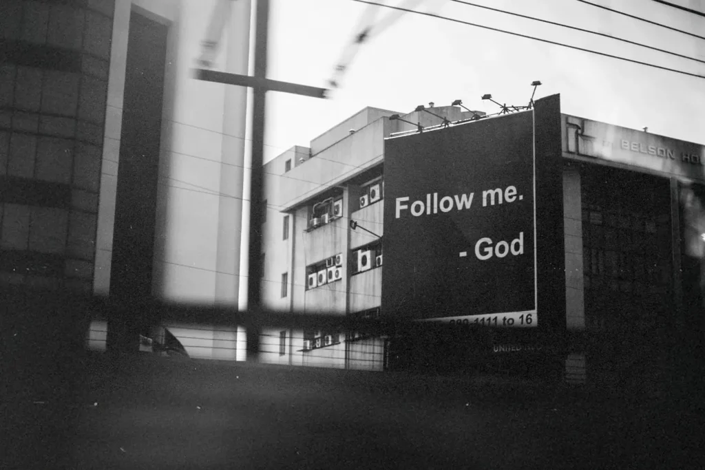 Sign that says "Follow Me. - God"