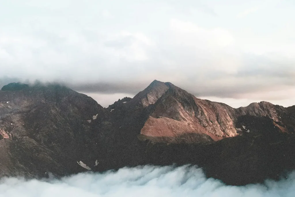 Clouds resting in the valley of mountains