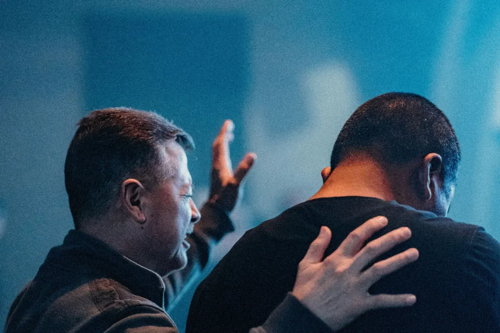 two men praying for healing