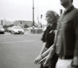 Blurred image of a couple holding hands walking