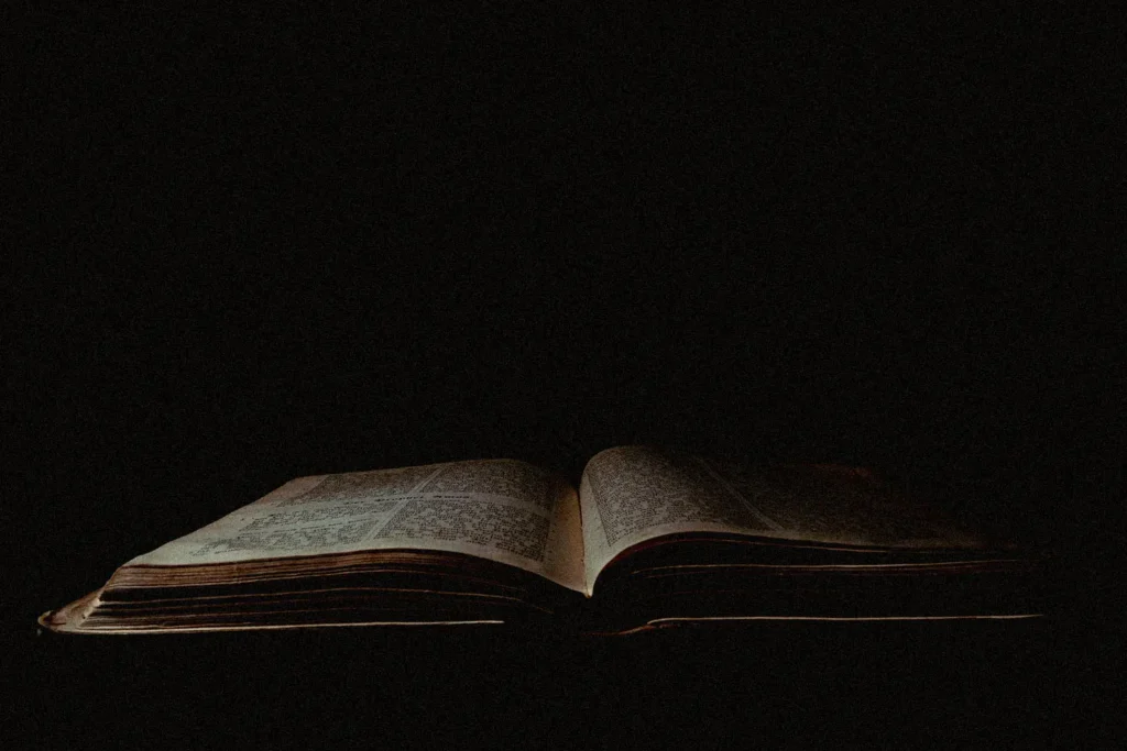 Dim light shining on an open Bible