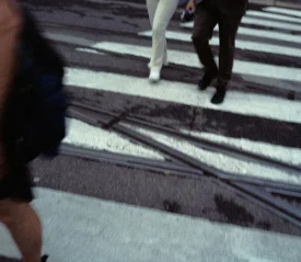 Leg shots of group of people walking on a crosswalk