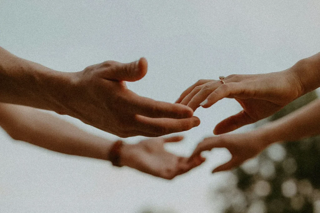 man and woman holding hands