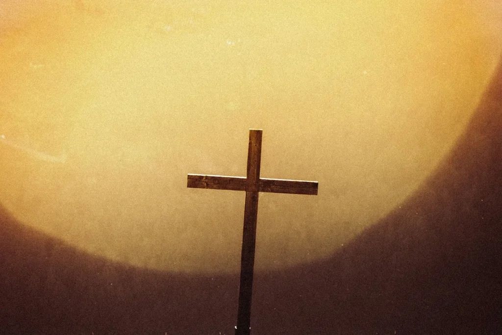 cross in front of the sun