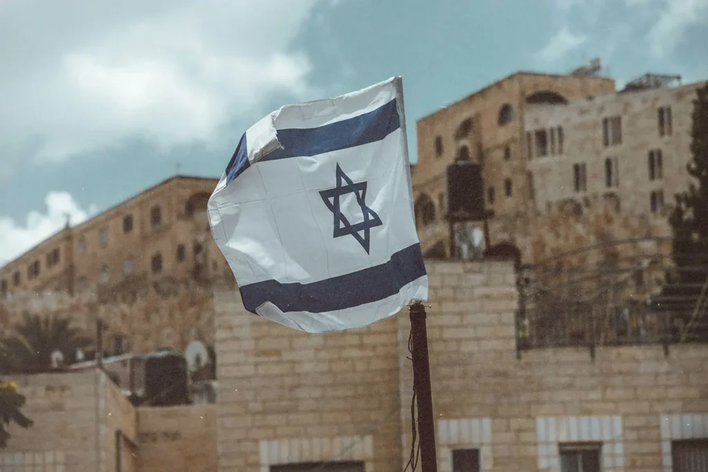 Flag of Israel flying in the middle of city center