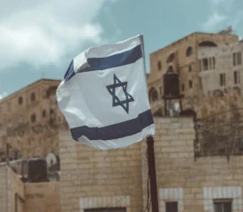 Flag of Israel flying in the middle of city center