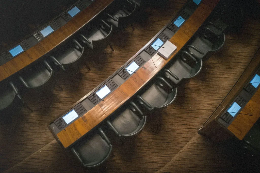 Row of college lecture room chairs and desks