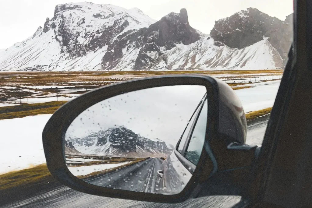 mountains in the side mirror of a car