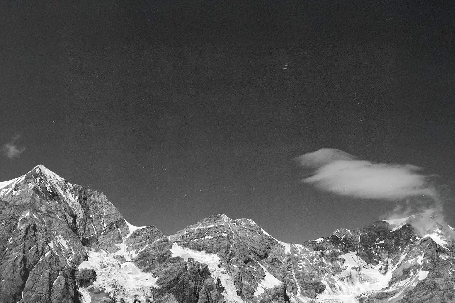 Black and white image of snowy mountain peaks