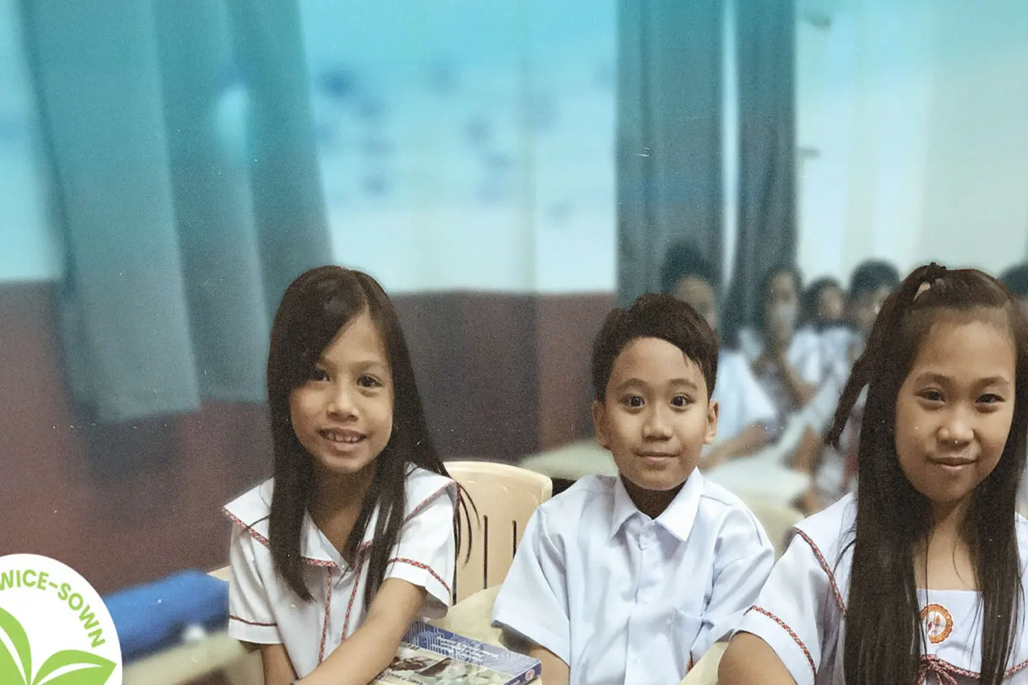 Filipino children in school uniforms smiling