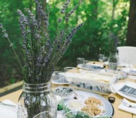 Table set with dining ware and a mason jar filled with lavender