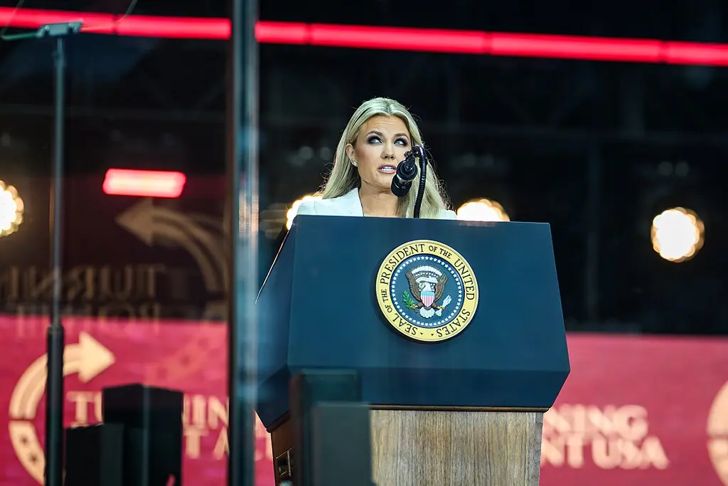 Erika Kirk speaks in front of the presidential seal at Charlie Kirk's memorial service.