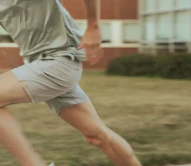 Person running on the sidewalk