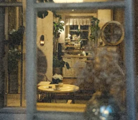 Looking through a window into a kitchen