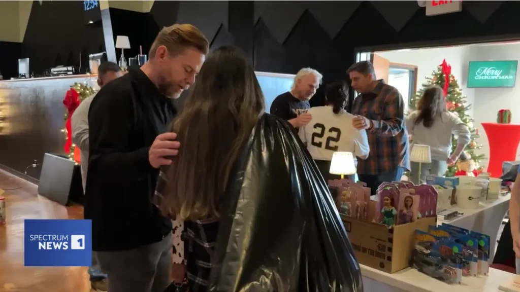 An adult man prays for someone at a Kerrville Christmas chapel in Central Texas