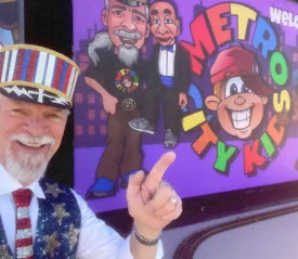 Dr. Terry Horn in front of a new screen for his children's urban ministry.